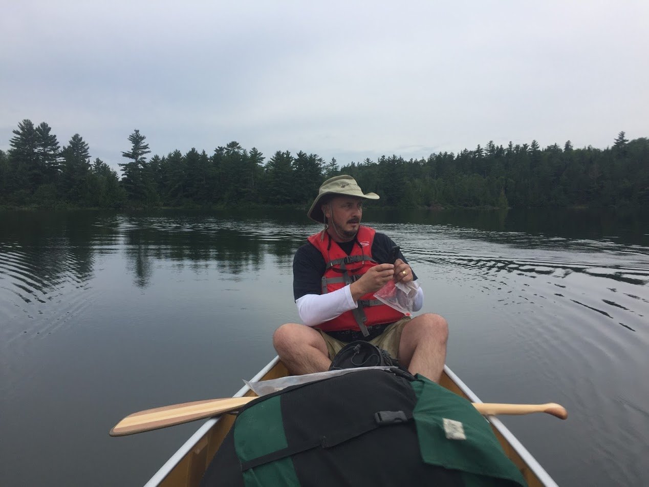 Fraser sits in a boat