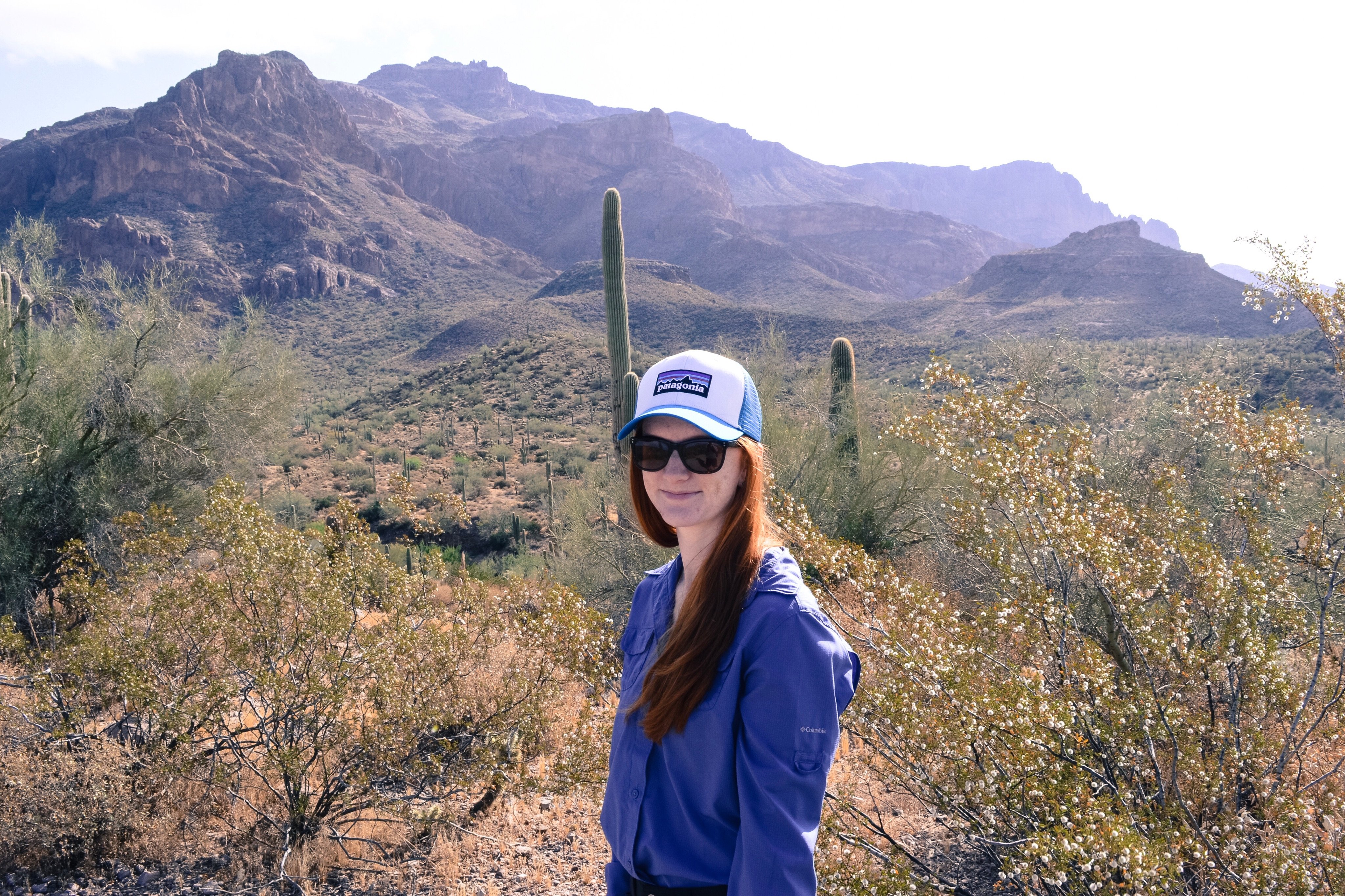 Kirsten stands on a hiking trail