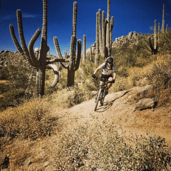 Pete rides his bike on an Arizona trail